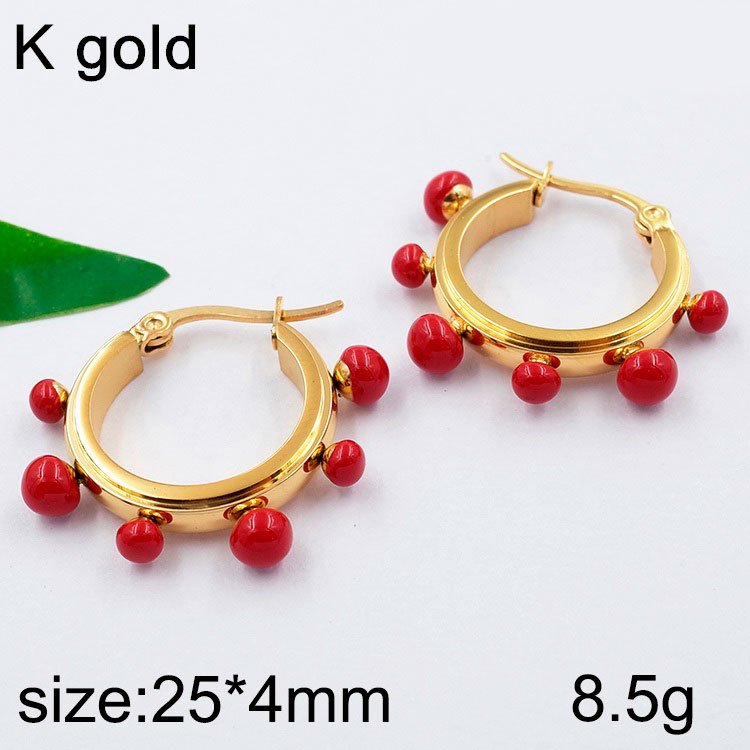 Argollas doradas 2.5cm con piedras rojas