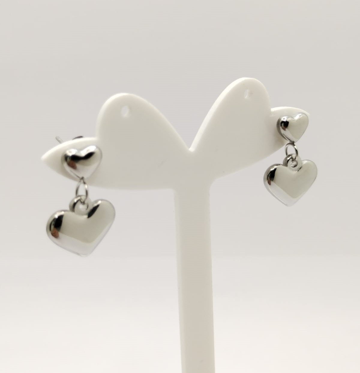 Aretes plateados doble corazoncito 1.9cm