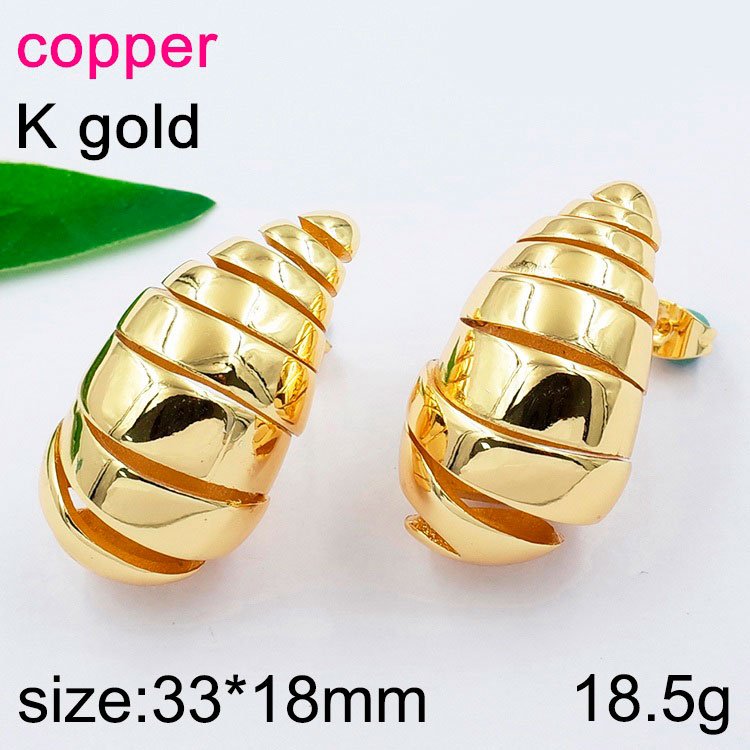 Aretes dorados diseño gota espiral 3.3cm