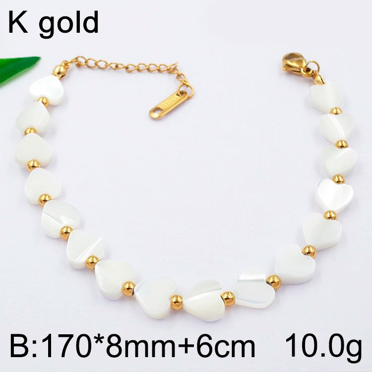 Pulsera dorada corazones nácar blanco