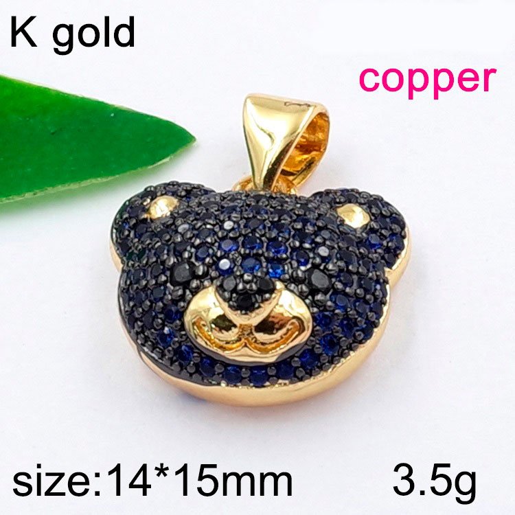 Dije dorado osito pedrería azul 1.4cm (laminado americano)