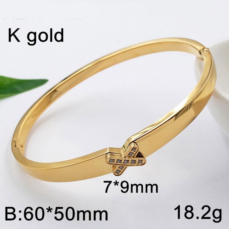 Brazalete dorado 6cm diseño X pedrería