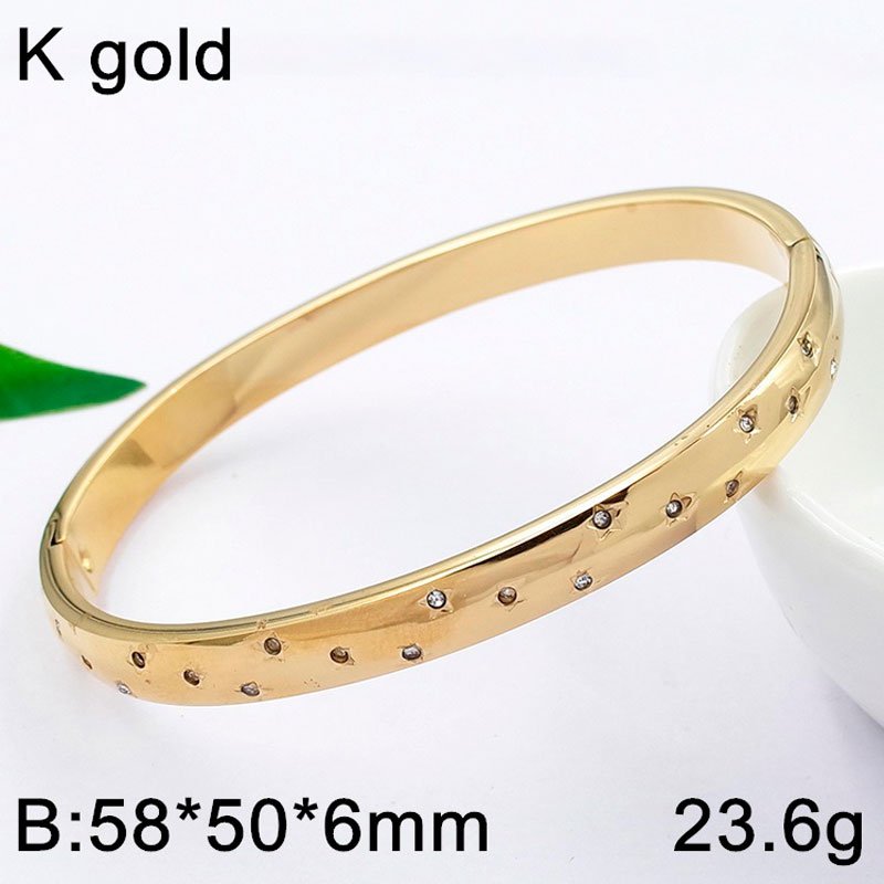 Brazalete dorado 6mm grosor, pedrería incrustada