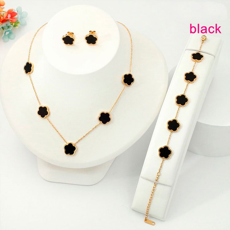 Set dorado 3 piezas con flores negras