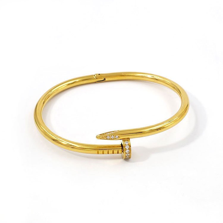 Set dorado Brazalete y anillo diseño Clavo_CArTiEr